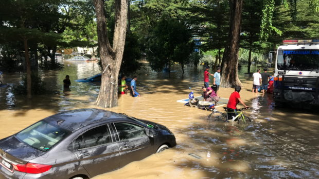 At least eight dead in Malaysia floods as rescue effort stumbles