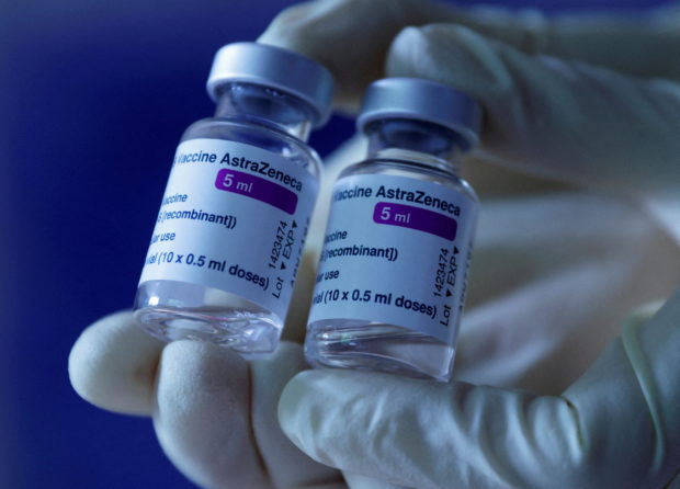 FILE PHOTO: A doctor shows vials of AstraZeneca's COVID-19 vaccine in his general practice facility, as the spread of the coronavirus disease (COVID-19) continues, in Vienna, Austria May 13, 2021. REUTERS/Leonhard Foeger