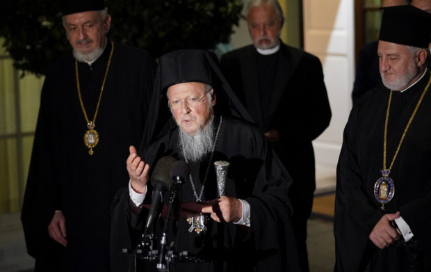 FILE PHOTO: Ecumenical Patriarch Bartholomew and the official delegation of the Orthodox Christian Church speak to reporters following their visit with U.S. President Joe Biden at the White House in Washington, U.S., October 25, 2021. REUTERS/Kevin Lamarque     