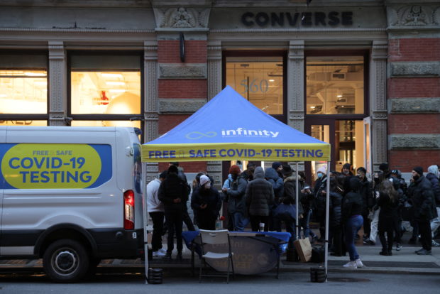 People queue for a COVID-19 test on Broadway in SoHo as the Omicron coronavirus variant continues to spread in Manhattan, New York City, U.S., December 27, 2021. REUTERS/Andrew Kelly