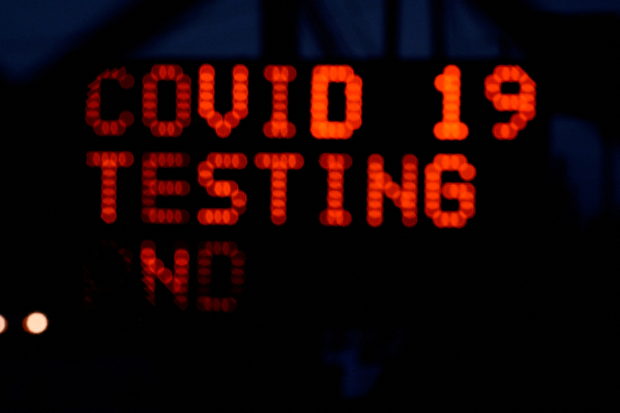 A sign advertises coronavirus disease (COVID-19) testing outside the Indianapolis Motor Speedway, as the Omicron variant continues to spread in Indianapolis, Indiana, U.S., December 29, 2021.  REUTERS/Cheney Orr/File Photo