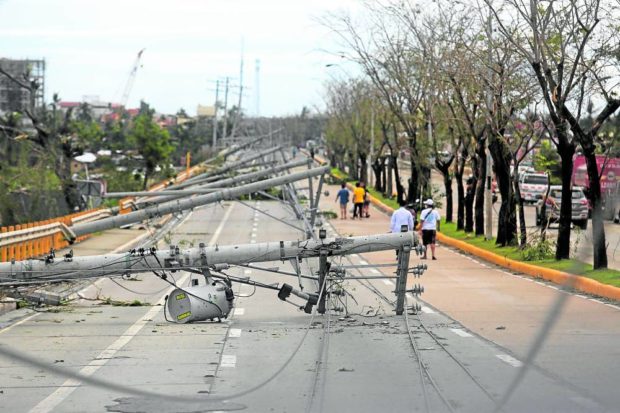 Fallen power lines in Talisay City in Cebu after Typhoon Odette. STORY: ‘Massive search’ for cable thieves in Visayas, PNP assures telco