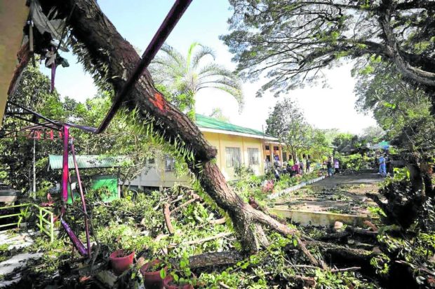Mother recounts losing 11-month-old baby as 'Odette' toppled houses in their village