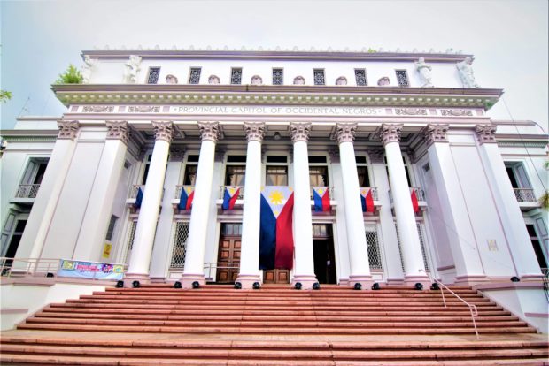 The Philippine flag in front of the Negros Occidental Capitol flies at half-mast for a Negrense historian who died.