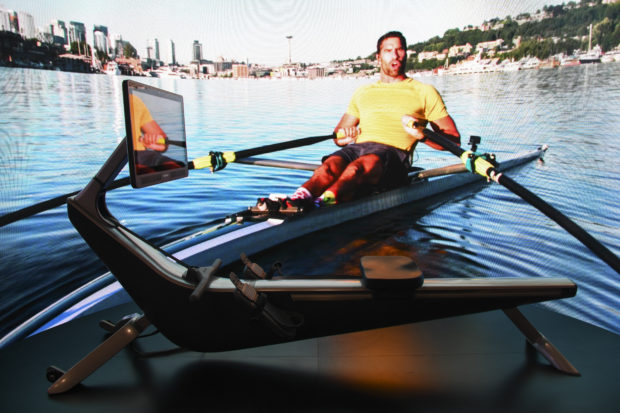 A Hydrow rowing machine is displayed during the Consumer Electronics Show (CES) on January 7, 2022 in Las Vegas, Nevada. - Interactive comment sections and virtual reality headsets: internet-connected fitness gear and services have boomed during the pandemic as at-home athletes seek a proxy for gym life. While home workouts long predate the coronavirus, they have taken on a social aspect that looks set to become the standard in a world reshaped by the pandemic. (Photo by Patrick T. FALLON / AFP