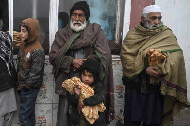 Desperate Afghans queue for free bread as poverty crisis deepens