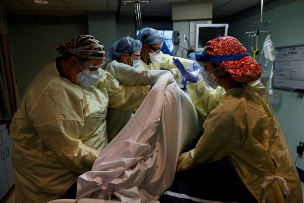 Overwhelmed by Omicron surge, US hospitals delay surgeries