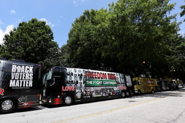 FILE PHOTO: Buses used for the Freedom Ride For Voting Rights are seen during a stop at Ebenezer Baptist Church in Atlanta, Georgia, U.S., June 21, 2021. Picture taken June 21, 2021. REUTERS/Dustin Chambers/File Photo