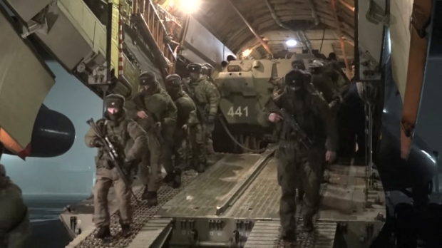 FILE PHOTO: Russian service members disembark from a military aircraft, as part of a peacekeeping mission of the Collective Security Treaty Organisation amid mass protests in Almaty and other Kazakh cities, at an airfield in Kazakhstan, in this still image from video released by Russia's Defence Ministry January 8, 2022. Russian Defence Ministry/Handout via REUTERS