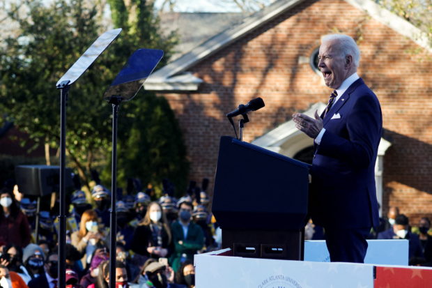 U.S. President Joe Biden delivers remarks on voting rights during a speech on the grounds of Morehouse College and Clark Atlanta University in Atlanta, Georgia, U.S., January 11, 2022. REUTERS/Jonathan Ernst