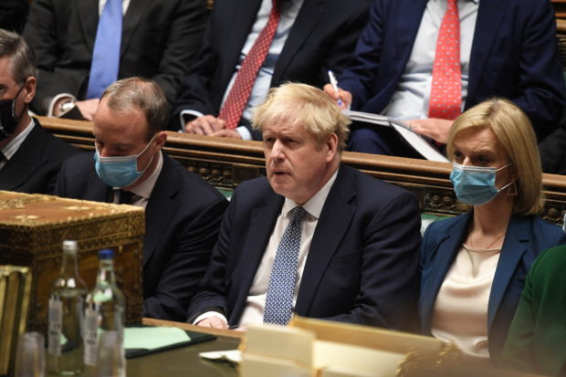 FILE PHOTO: British Prime Minister Boris Johnson attends the weekly Prime Minister's Questions at the parliament in London, Britain, January 12, 2022. UK Parliament/Jessica Taylor/Handout via REUTERS