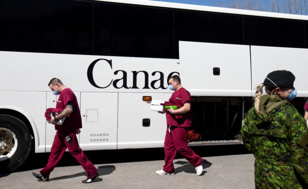 A bus carrying Canadian Armed Forces (CAF) medical personnel arrives at Villa Val des Arbres,  a seniors' long-term care centre, to help amid the outbreak of the coronavirus disease (COVID-19), in Montreal, Quebec, Canada April 20, 2020. REUTERS/Christinne Muschi