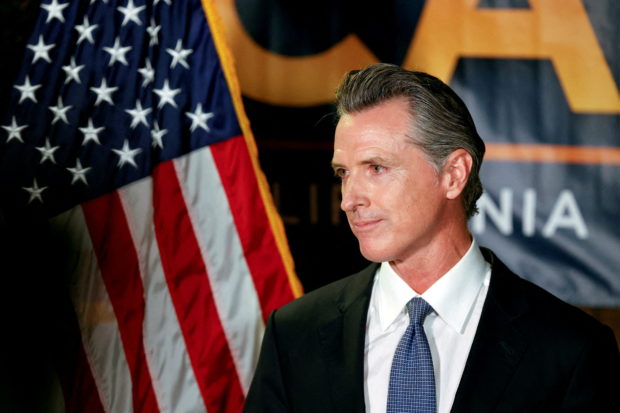 FILE PHOTO: California Governor Gavin Newsom makes an appearance at the California Democratic Party headquarters in Sacramento, California, U.S., September 14, 2021.  REUTERS/Fred Greaves/File Photo
