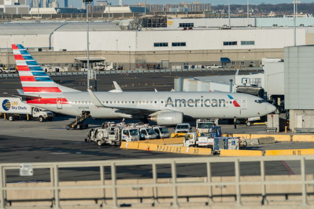 An American Airlines airplane is seen at John F. Kennedy International Airport during the spread of the Omicron coronavirus variant in Queens, New York City, U.S., December 26, 2021. REUTERS/Jeenah Moon