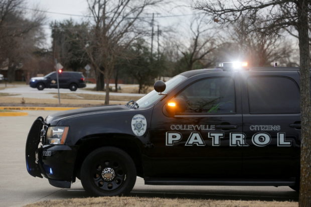 Law enforcement vehicles are seen in the area where a man has reportedly taken people hostage at a synagogue during services that were being streamed live, in Colleyville, Texas, U.S. January 15, 2022. REUTERS/Shelby Tauber