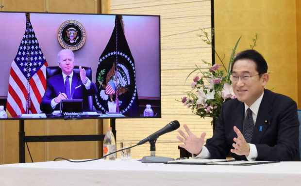 Japan's Prime Minister Fumio Kishida attends a virtual meeting with the U.S. President Joe Biden at his official residence in Tokyo, Japan January 21, 2022,  in this photo released by Japan's Cabinet Public Relations Office via Kyodo.  Japan's Cabinet Public Relations Office via Kyodo/via REUTERS Mandatory credit Kyodo/via REUTERS ATTENTION EDITORS - THIS IMAGE WAS PROVIDED BY A THIRD PARTY. MANDATORY CREDIT. JAPAN OUT. NO COMMERCIAL OR EDITORIAL SALES IN JAPAN.