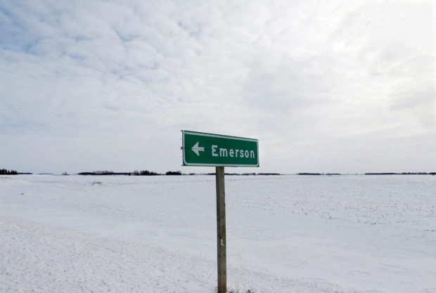 A sign post for the small border town of Emerson, near the Canada-U.S border crossing in Emerson, Manitoba, Canada, February 1, 2017. REUTERS/Lyle Stafford