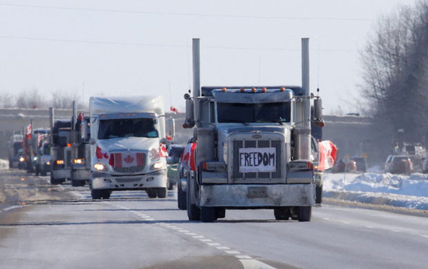 Truckers arrive in a convoy to protest coronavirus disease (COVID-19) vaccine mandates for cross-border truck drivers, in Ottawa, Ontario, Canada, January 28, 2022.  REUTERS/Patrick Doyle
