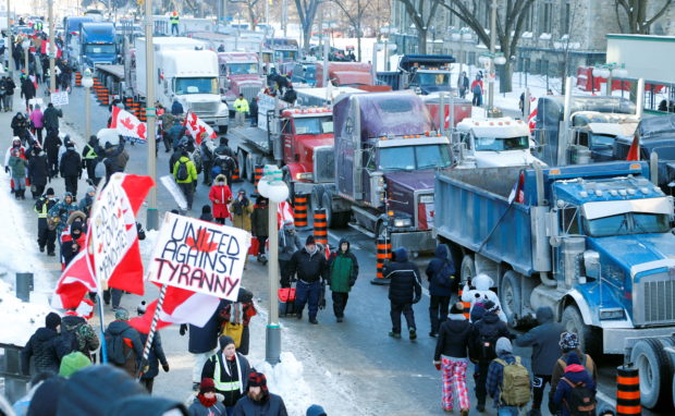 Trucks sit parked on Wellington Street near the Parliament Buildings as truckers and their supporters take part in a convoy to protest coronavirus disease (COVID-19) vaccine mandates for cross-border truck drivers in Ottawa, Ontario, Canada, January 29, 2022. REUTERS/Patrick Doyle