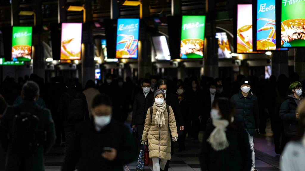 Japan brings back virus restrictions