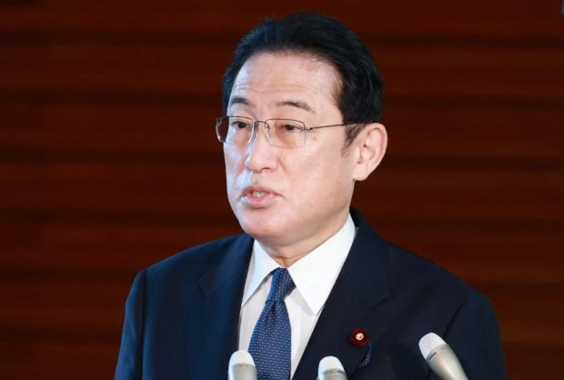 Japan's Prime Minister Fumio Kishida speaks to the media about the crisis between Russia and Ukraine, at the prime minister's office in Tokyo on February 22, 2022. (Photo by JIJI PRESS / AFP) / Japan OUT