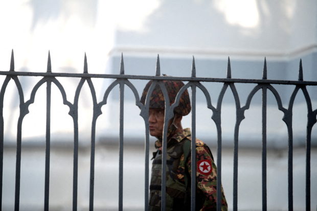 A Myanmar soldier looks on as he stands inside city hall after soldiers occupied the building, in Yangon, Myanmar February 2, 2021. REUTERS/Stringer/File Photo