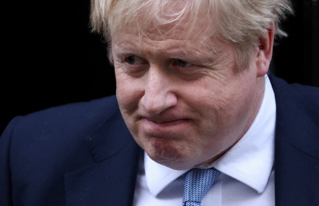FILE PHOTO: British Prime Minister Boris Johnson walks outside 10 Downing Street in London, Britain, January 31, 2022. REUTERS/Henry Nicholls