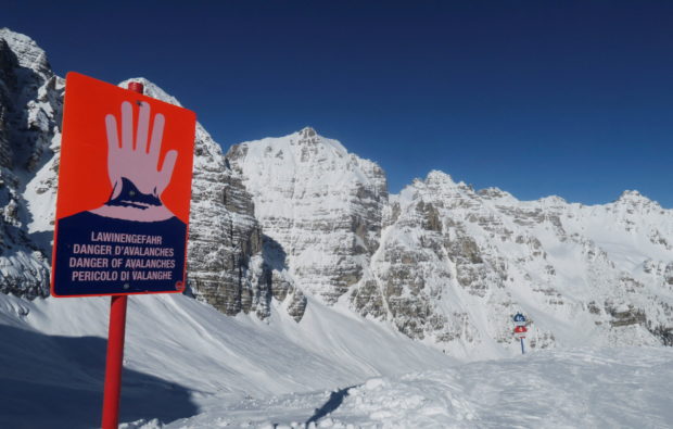 FILE PHOTO: An avalanche warning sign is seen next to the slope at Schlick 2000 ski resort near Neustift im Stubaital, Austria February 6 2020.   REUTERS/Leonhard Foeger/File Photo