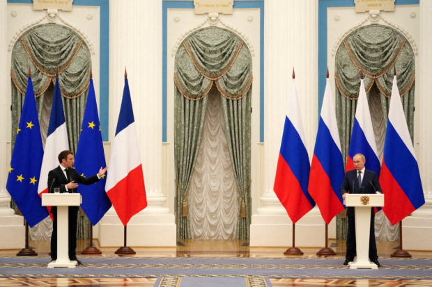Russian President Vladimir Putin and French President Emmanuel Macron, attend a joint press conference, in Moscow, Russia, February 7, 2022. Thibault Camus/Pool via REUTERS