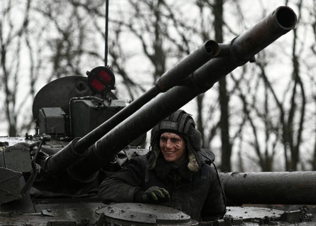 A Russian service member is seen on a BMP-3 infantry fighting vehicle during drills held by the armed forces of the Southern Military District at the Kadamovsky range in the Rostov region, Russia February 3, 2022. REUTERS/Sergey Pivovarov