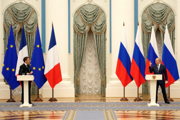 FILE PHOTO: Russian President Vladimir Putin and French President Emmanuel Macron, attend a joint press conference, in Moscow, Russia, February 7, 2022. Thibault Camus/Pool via REUTERS/File Photo