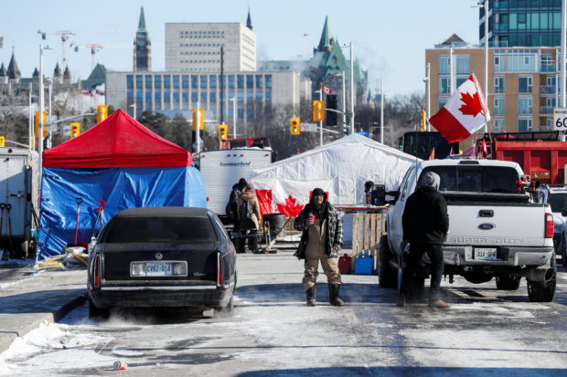 Truckers and supporters continue to protest coronavirus disease (COVID-19) vaccine mandates from the camp at the Canadian War Museum, in Ottawa, Ontario, Canada, February 14, 2022. REUTERS/Lars Hagberg