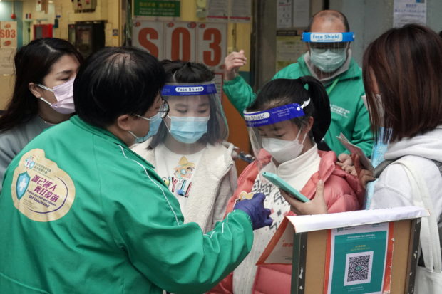 Hong Kong parents rush to vaccinate children as COVID-19 surges