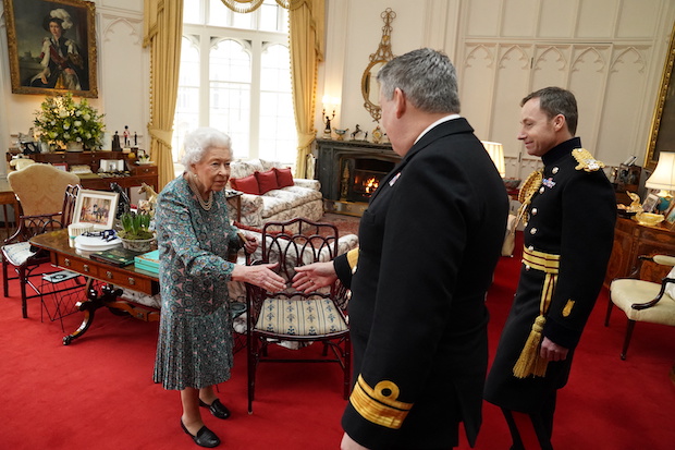 Photo of Messages pour in after UK’s Elizabeth catches COVID-19 Britain's Queen Elizabeth with military officers, for story: