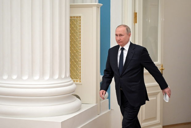 FILE PHOTO: Russian President Vladimir Putin arrives for a meeting with representatives of the business community at the Kremlin in Moscow, Russia February 24, 2022. Sputnik/Aleksey Nikolskyi/Kremlin via REUTERS