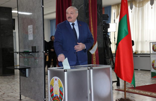 Belarusian President Alexander Lukashenko casts his ballot at the referendum on the amendments and additions to the Constitution of Belarus, in Minsk, Belarus February 27, 2022. Nikolay Petrov/BelTA/Handout via REUTERS