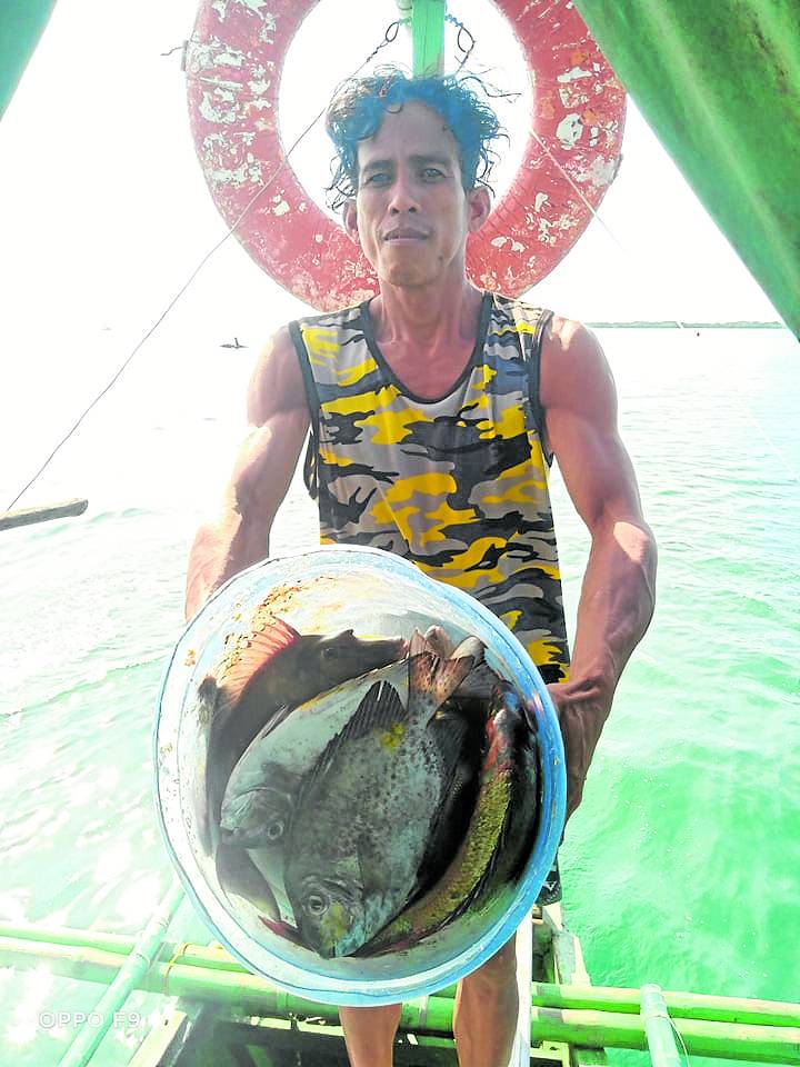 Photo of a Cebu fisherman for story: Reshaping Cebu