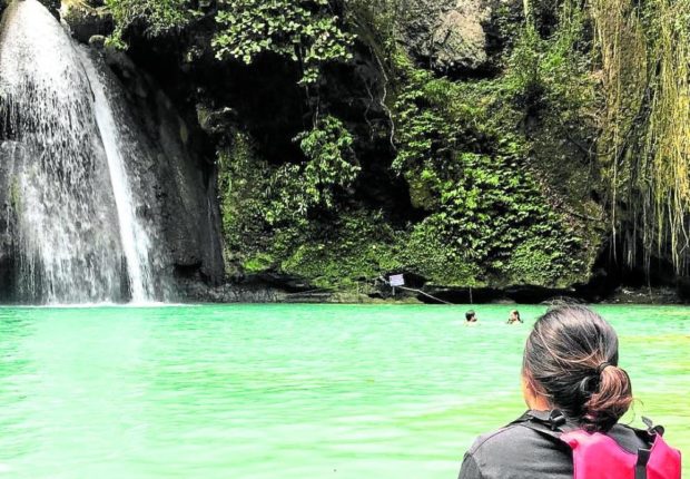 Tourists at Kawasan Falls in Badian, Cebu, photo for story: Central Visayas tourism losses hit P3.3 billion