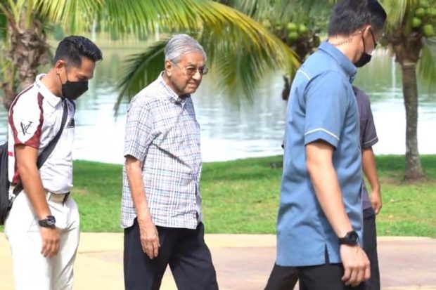 Malaysia's Mahathir takes lakeside stroll after recovering from 'severe illness'