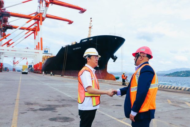 Ronnie Yambao (left), senior deputy administrator for operations of the Subic Bay Metropolitan Authority (SBMA), shakes hands with Pankaj Patki, Mediterranean Shipping Company general manager, to welcome the world’s largest shipping line to Subic Bay Freeport