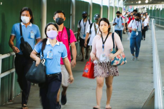 Subic employees wearing face masks, story for: Gov’t eyes transition to ‘new normal’ in March