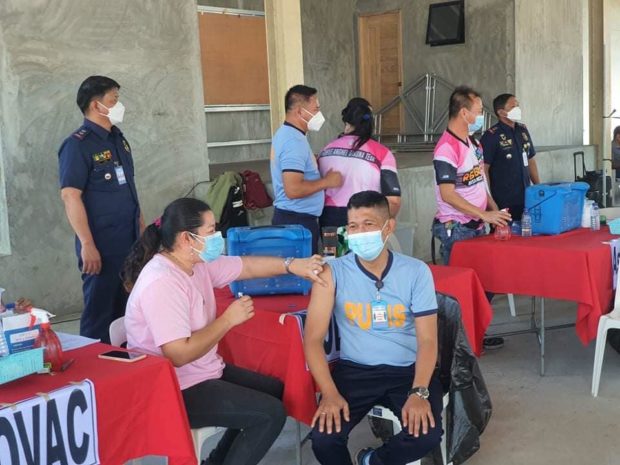 police officer gets his booster shot in Tarlac