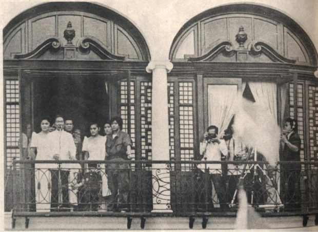 Ferdinand Marcos Jr (sixth from left) wears a military uniform as his father, the late dictator Ferdinand Marcos, delivers a speech hours before the Marcos family fled Malacañang. PHOTO FROM MR. AND MS.