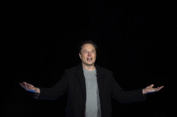 (FILES) In this file photo taken on February 10, 2022 Elon Musk gestures as he speaks during a press conference at SpaceX's Starbase facility near Boca Chica Village in South Texas. - Put up your dukes, Vlad. Elon Musk, the world's richest man, on March 14, 2022 challenged Russian President Vladimir Putin to a fight, with nothing less than the fate of Ukraine, scene of Moscow's brutal invasion, at stake. (Photo by JIM WATSON / AFP)