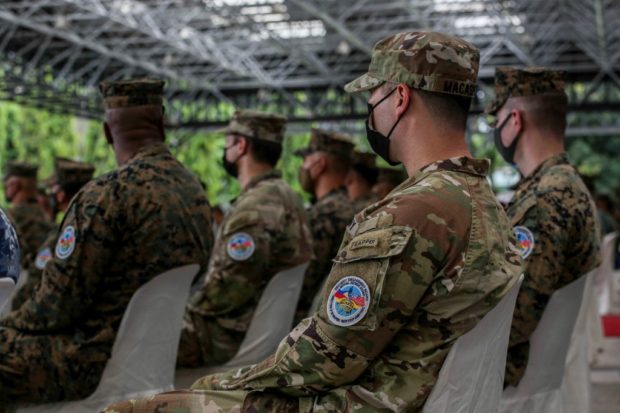 Military officers wears the Balikatan patch during the opening ceremony for a 12-day joint military drill, at Camp Aguinaldo in Quezon City, east of Manila on March 28, 2022. STORY: US, PH kick off largest military exercises