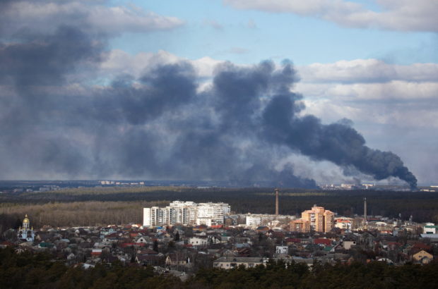 FILE PHOTO: Smoke rising after shelling on the outskirts of the city is pictured from Kyiv, Ukraine February 27, 2022. REUTERS/Mykhailo Markiv/File Photo