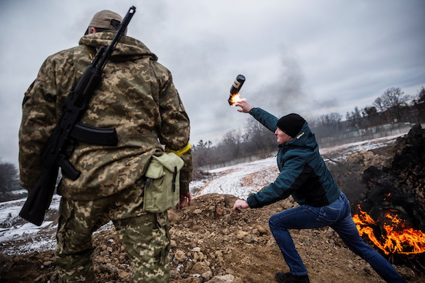 Civilians train to throw Molotov cocktails, FOR STORY: Ukrainians fighting on in biggest city yet claimed by Russia