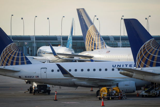 FILE PHOTO: United Airlines planes are parked at their gates at O'Hare International Airport ahead of the Thanksgiving holiday in Chicago, Illinois, U.S., November 20, 2021. REUTERS/Brendan McDermid
