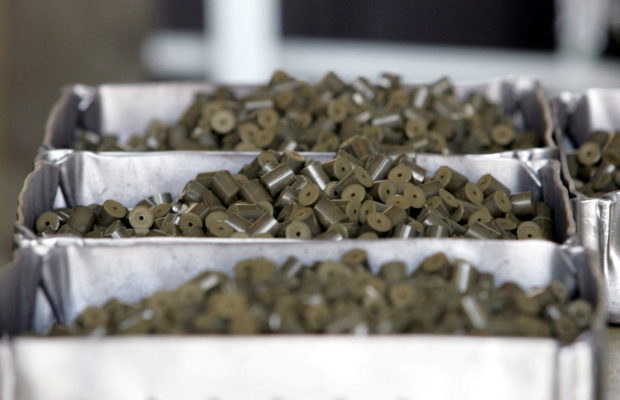 FILE PHOTO: Uranium pellets, a nuclear fuel product for atomic power plants, are seen on a production line at Ulba Metallurgical Plant in Kazakhstan's eastern town of Ust-Kamenogorsk August 11, 2006. REUTERS/Shamil Zhumatov/File Photo