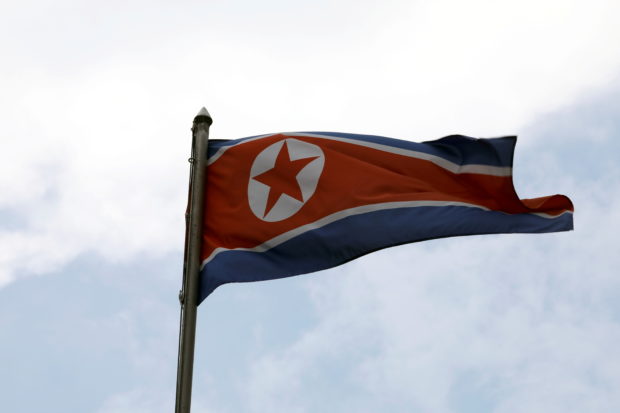 FILE PHOTO: A North Korean flag flutters at the North Korean embassy in Kuala Lumpur, Malaysia March 19, 2021. REUTERS/Lim Huey Teng/File Photo